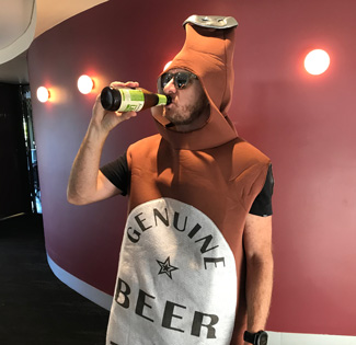 Fundraiser drinking beer in costume